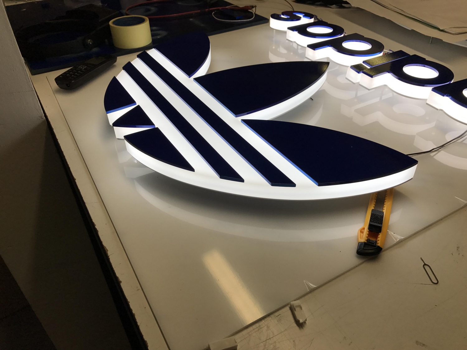 Adidas illuminated logo